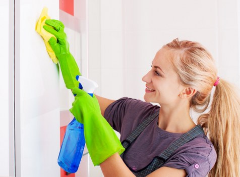 Technician preparing carpet cleaning equipment in a safe indoor setting