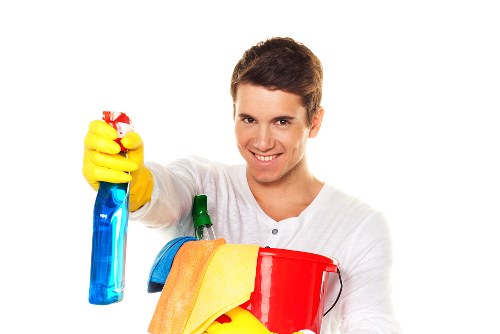 Cleaner maintaining a kitchen and bathroom in Stjohnswood